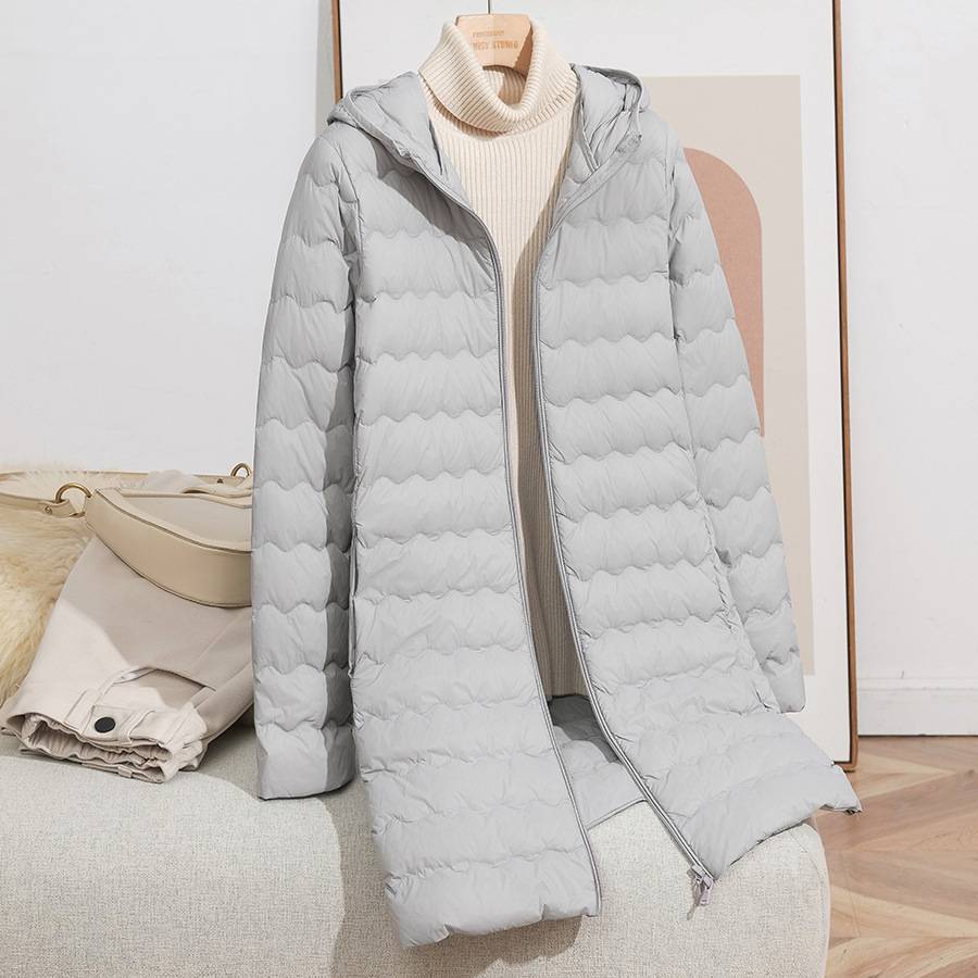 2025 otoño y invierno nueva moda encapuchada onda media y larga chaqueta de pluma ligera y delgada chaqueta con cremallera de mujer caliente marea
