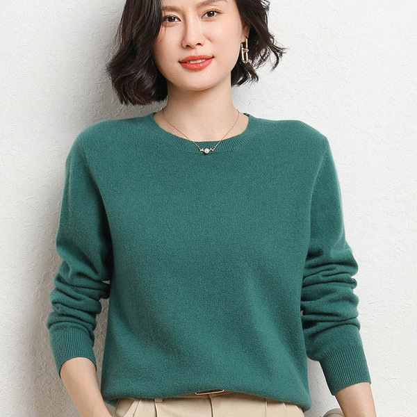 Knitted sweater with a round collar
