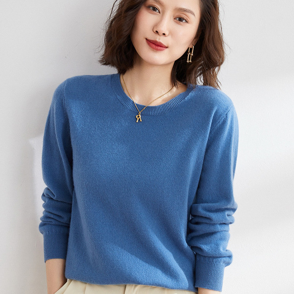 Knitted sweater with a round collar