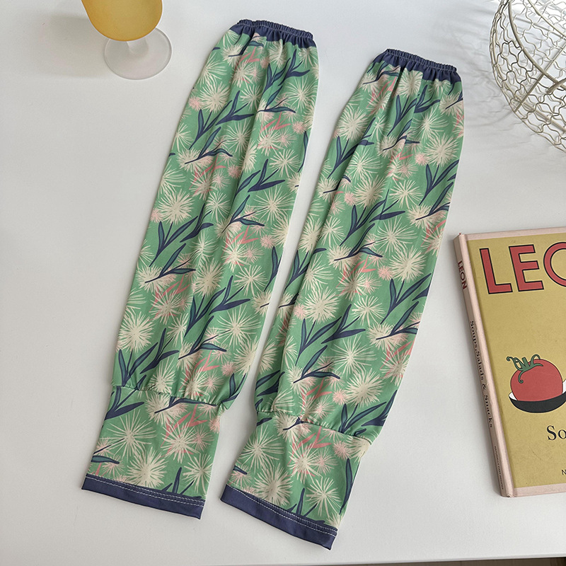 Mangas de protección solar para mujeres de verano nuevo estilo al aire libre anti-UV patrón de montar mangas de brazo de impresión de viento elegante