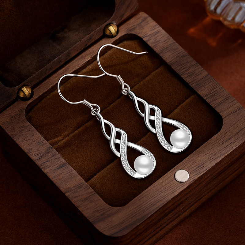 Pendientes de perlas de agua dulce - distribución de tapones de plástico