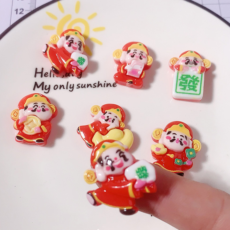 Año Nuevo dibujos animados dios de la fortuna Yuanbao accesorios de resina agujero zapatos caja de teléfono celular crema pegamento DIY automóvil control central dios de la fortuna