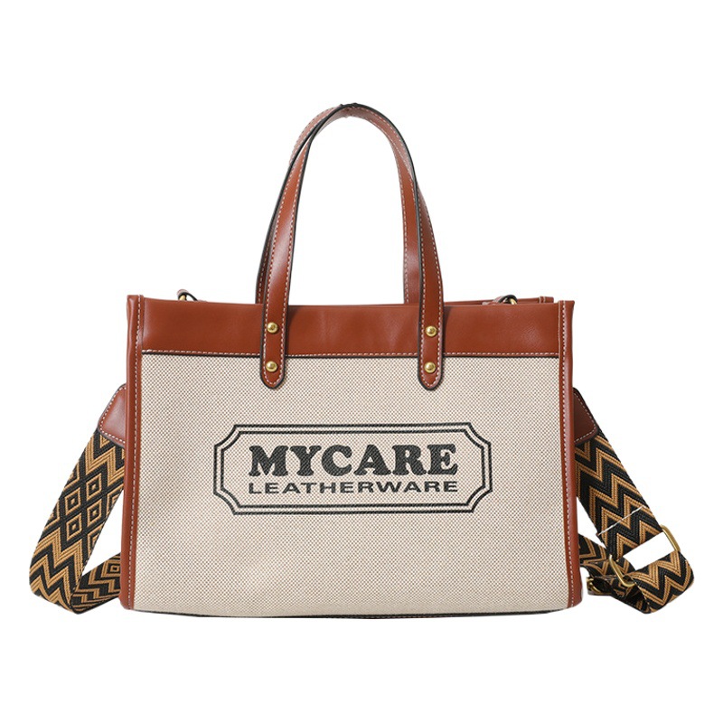 Bolso tote de gran capacidad, bolso de mano para clase y viajes, el popular bolso bandolera con estampado de letras de moda de este año.