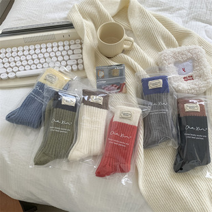 2024 Han ins blogger with color matching wool socks for women in autumn and winter warm thickened letters cloth label pile socks for women