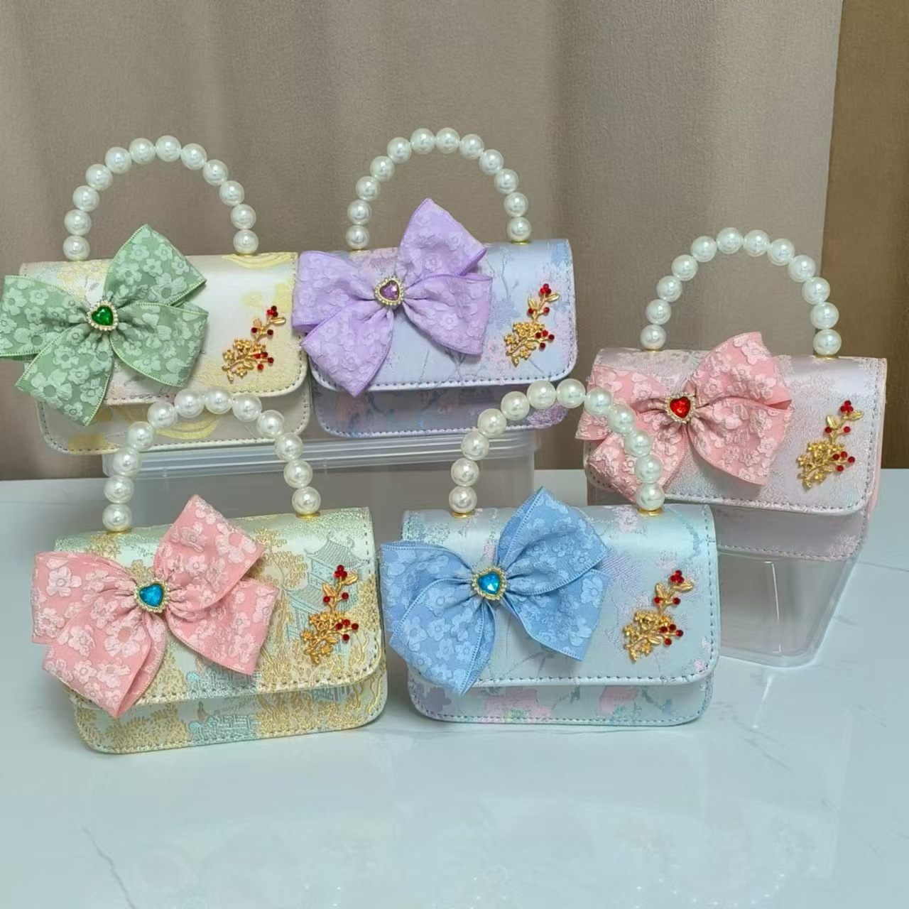 Bolso infantil nuevo bolso de hombro de niñas lindos bolsos de perlas de princesa arco de mariposa estilo nacional bolso de mochila pequeña bolsa