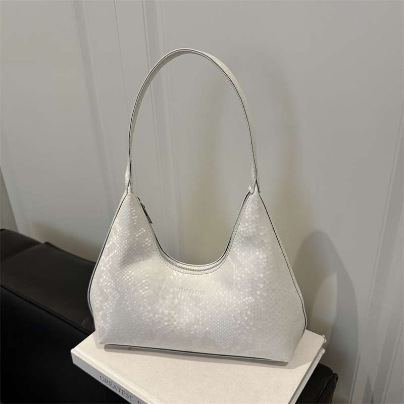 Bolsa de brazalete de hombro, primavera y verano de moda con patrón de serpiente, 2025 ocio, nuevo estilo coreano de textura simple, bolsa de tendencia de braza.