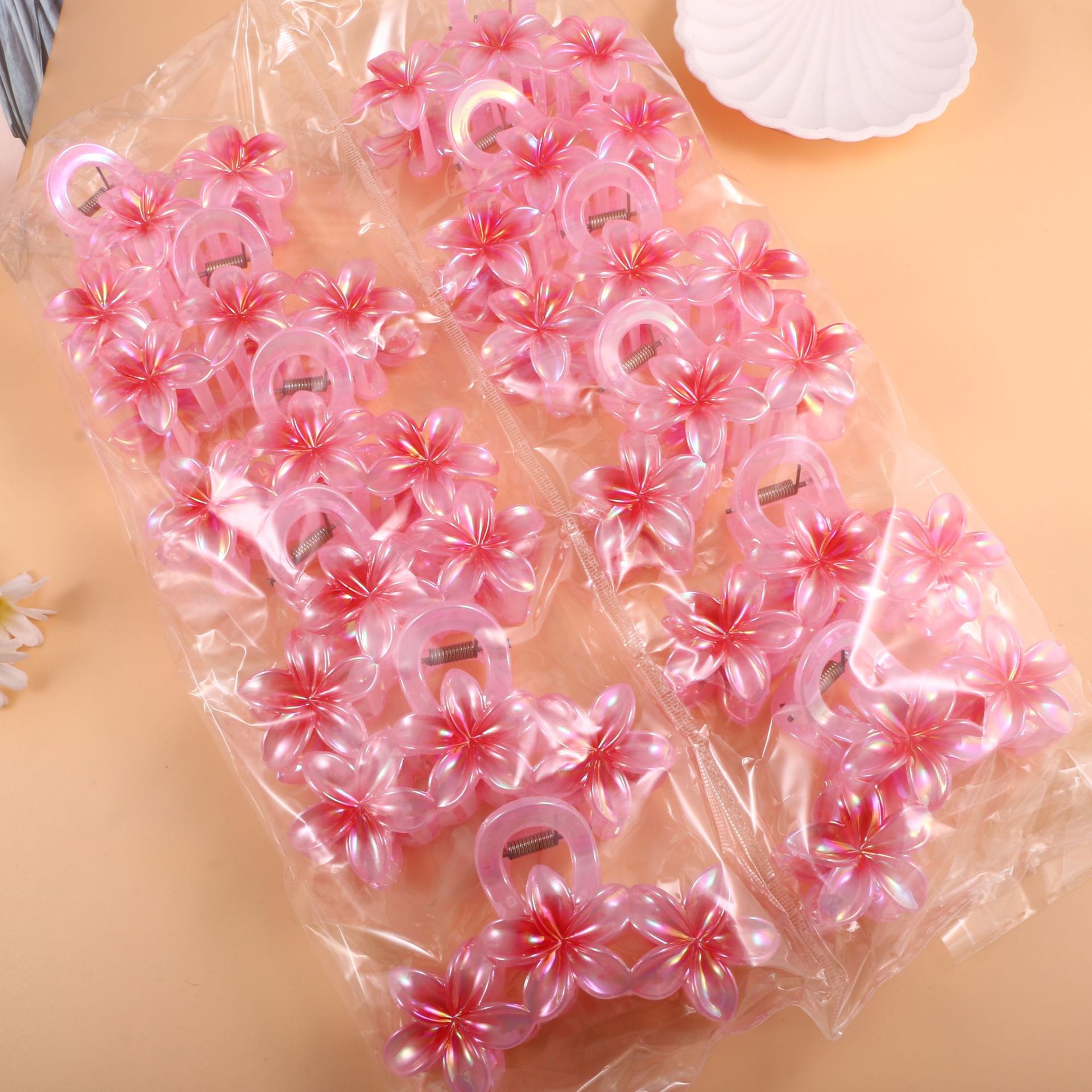 Nuevo color frangipani acrílico pinza para el cabello flor pinza de agarre de alta calidad elegante accesorio para el cabello de mujer pinza de tiburón de agarre lateral