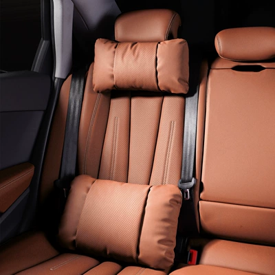 Waist support: Model Y headrest, updated Y - 1-headrest-and-1-lumbar-support-in-emma-orange-nappa-leather-for-comfort-and-stress-relief