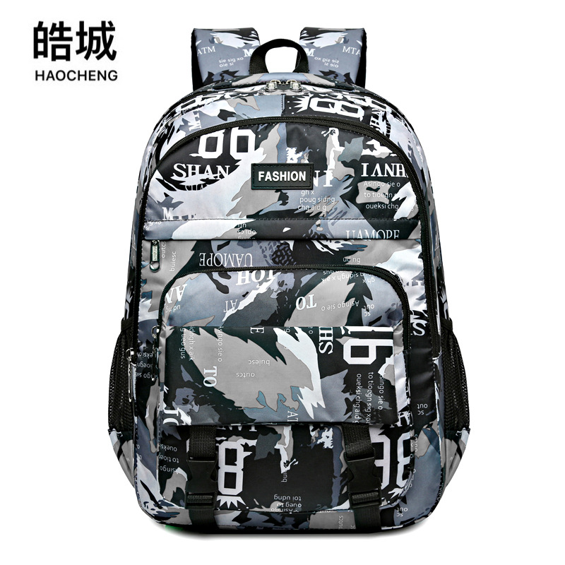 Mochila de moda informal para estudiantes nuevos y geniales transfronterizos Viajes al aire libre Viajes Oxford Camuflaje Mochila para computadora Tendencia