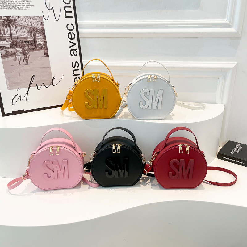 2025 primavera nueva impresión de letras de moda redondas personalidad simple nicho ocio mochila de tendencia de mujer viaje