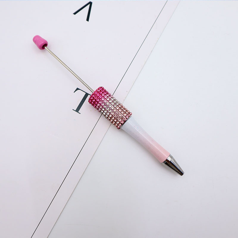 Bolígrafo giratorio de grano lindo de color degradado de tendencia de alto valor Bolígrafo de gomas galvanizado con cuentas de diamantes de bricolaje creativo