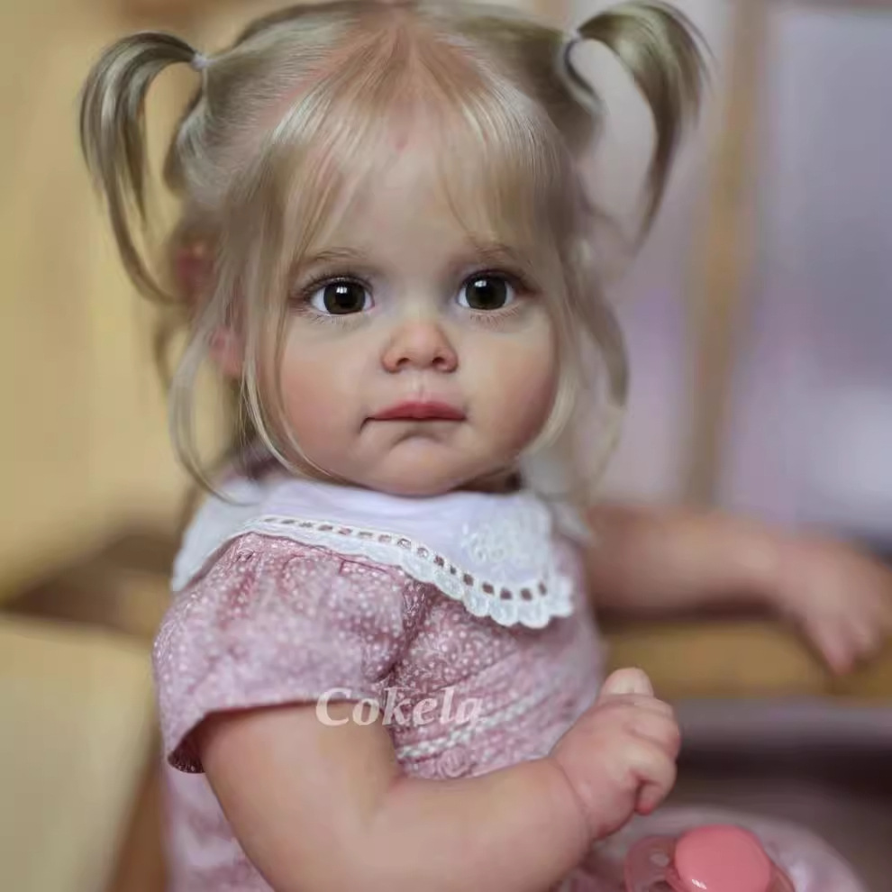 Cokela 58cm 3D simulación de alto color bebé renacido muñeca Maggi suministro transfronterizo entrega de una sola pieza