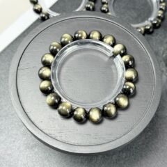 金曜石のブレスレットの卸売りの強い光の双眼線の猫の長い目の金曜石の手は男性の水晶のアクセサリの直接販売の金曜石を刺します。