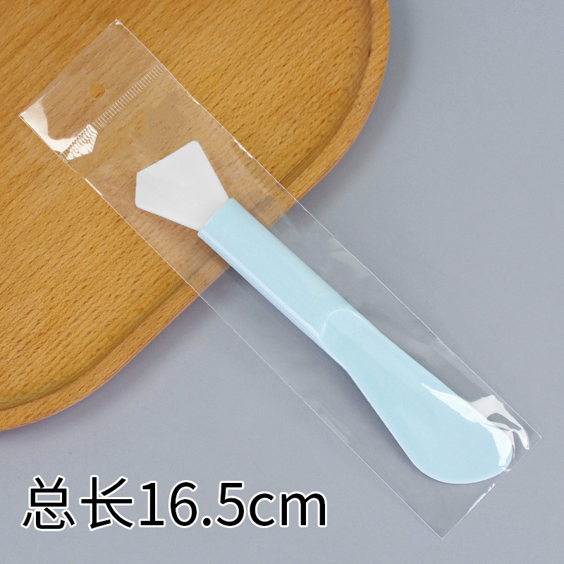 Large double-headed long-handled brush, diamond-shaped, lake blue.