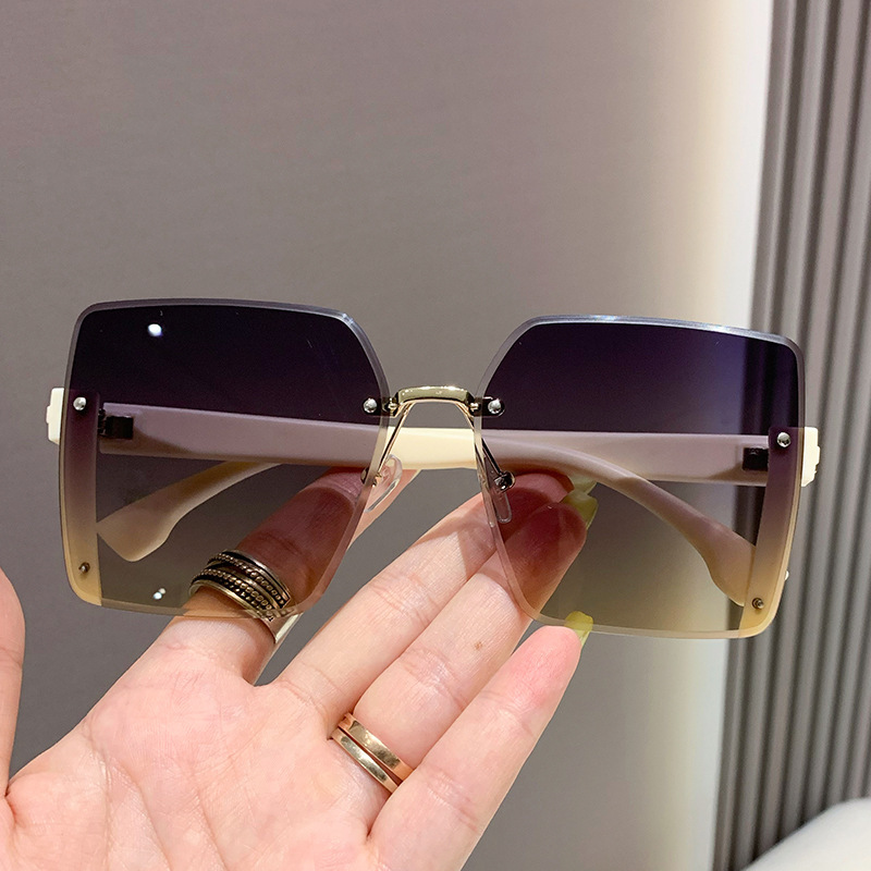 Nuevas gafas de sol de moda de alta calidad sin marco de borde de corte de las mujeres gafas de sol de gran marco a prueba de rayos UV gafas de sol de moda