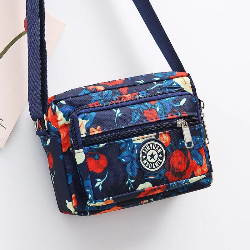 Bolsa de tela de flores bolsa de mensajero de las mujeres nueva bolsa de Madre de gran capacidad bolsa de hombro individual de mediana edad y ancianos bolsa de tela Oxford bolsa