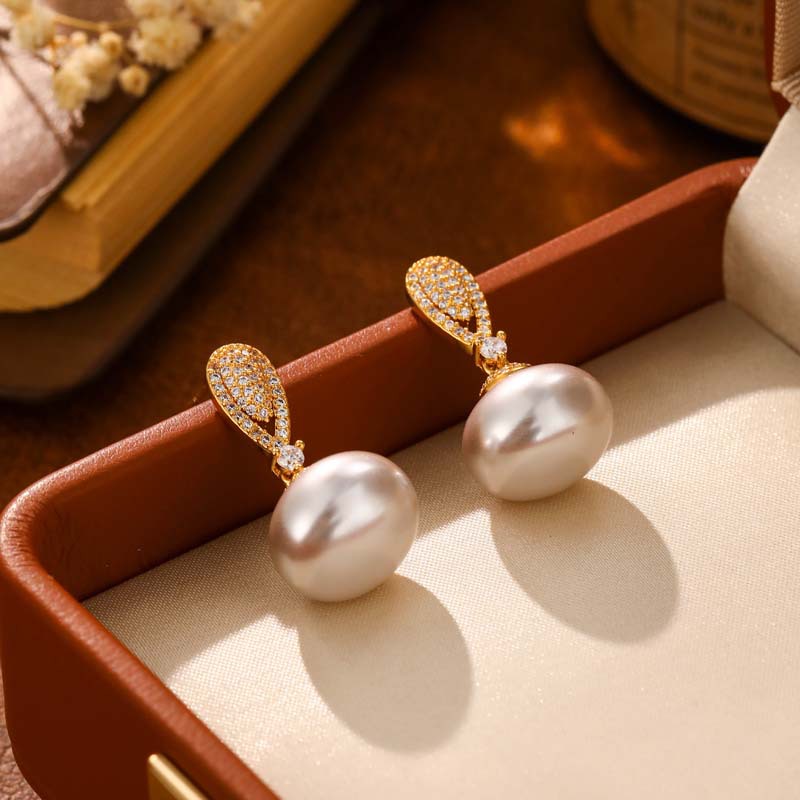 Elegant earrings with zircon drop-shaped from pearl