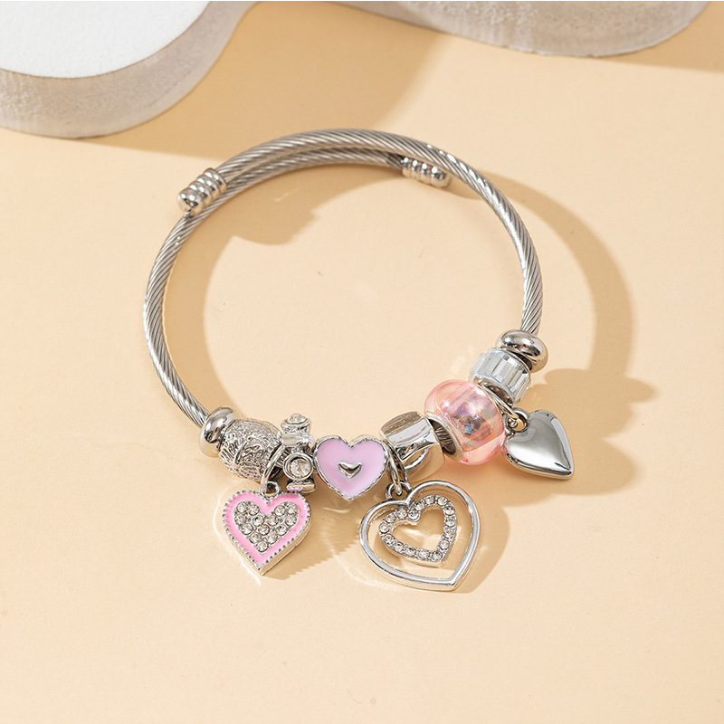 Panjia pulsera Dora DIY cuentas explosivas transfronterizas color rosa goteo amor colgante cuentas de cristal pulsera de acero en forma de corazón