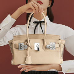 高品質の新型の長い本革の銀のボタンはプラチナのバッグの女性の頭の層の牛革のファッションの高級感のハンドバッグを持ちます。