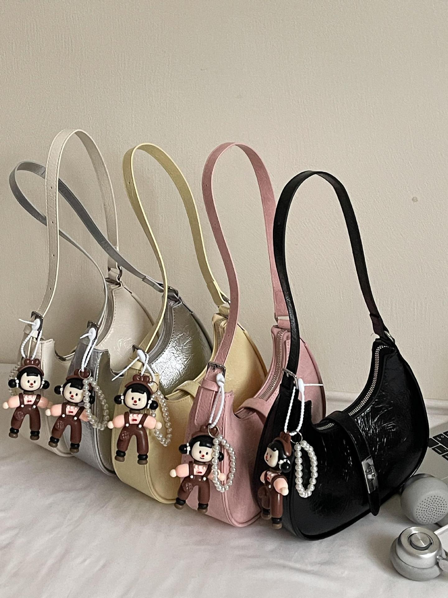 Bolsos de axila populares de verano para mujer 2025 nuevo bolso de hombro casual de todo fósforo bolso de media luna con patrón de agarre de mano de moda