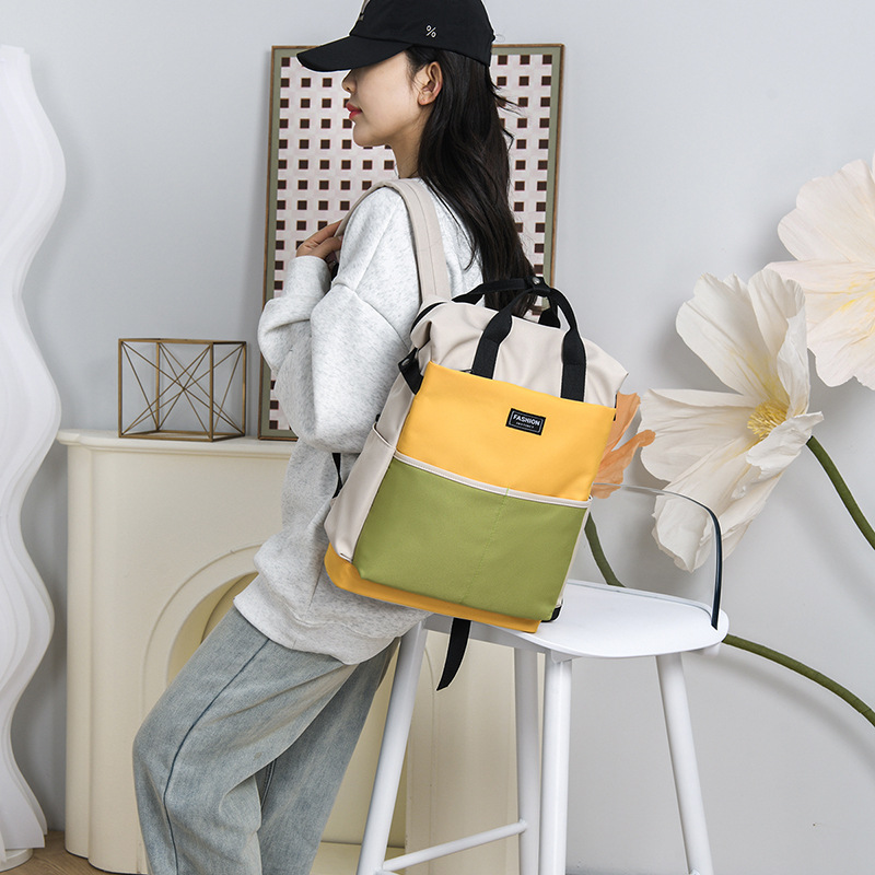 Bolso de mamá para madres y bebés de gran capacidad de estilo occidental, bolso de cercanías de almacenamiento de color en contraste de moda, mochila portátil multifuncional de un solo hombro
