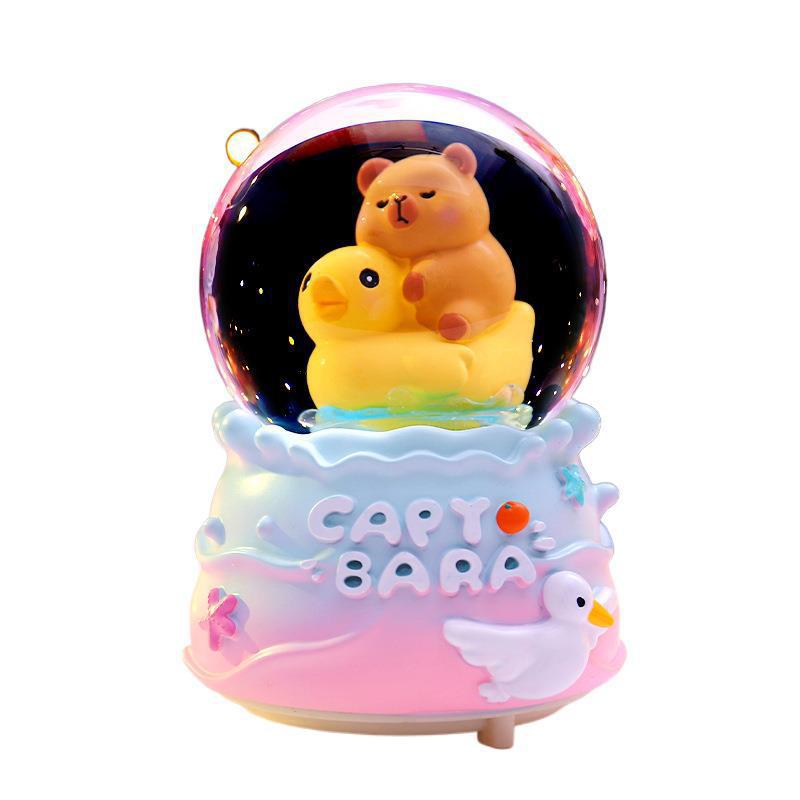 Red roja caliente Kapibala bola de cristal caja de música nieve que brilla estudiantes niños regalos navideños decoración de la habitación