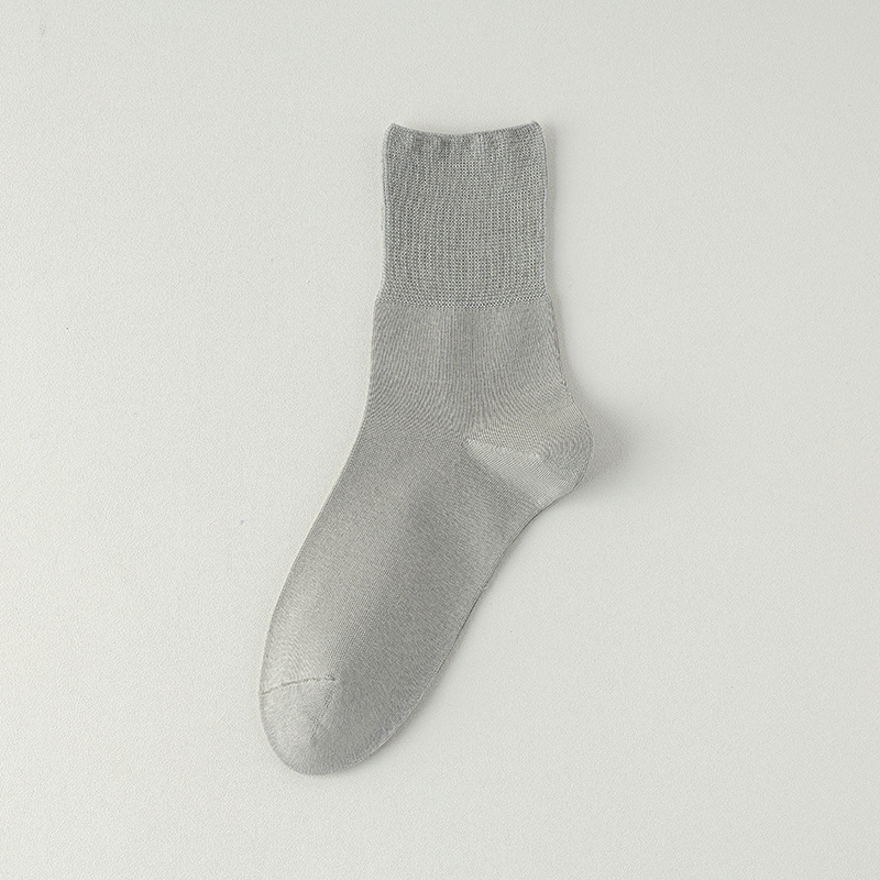 Calcetines de algodón de color sólido para hombres primavera, otoño y invierno en una máquina sin costura de hueso anti-balling embalaje independiente de calcetines de algodón