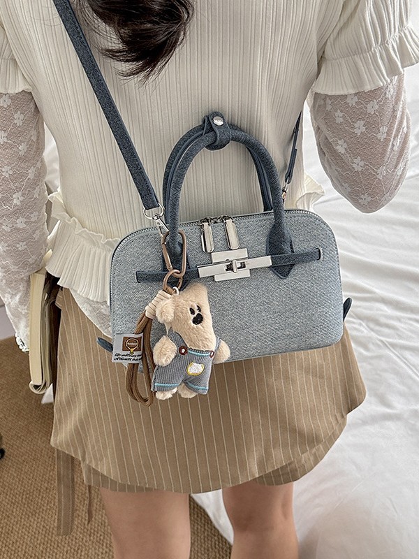 Bolsa de concha de nicho coreano para mujeres 2026 comercio exterior nuevo estilo de alta moda versátil mochila de hombro