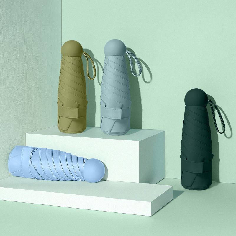 미니 휴대용 캡슐 우산 50% off 우산, 컴팩트한 블랙 플라스틱 자외선 차단 우산, 햇빛과 비 모두를 막아주는 우산