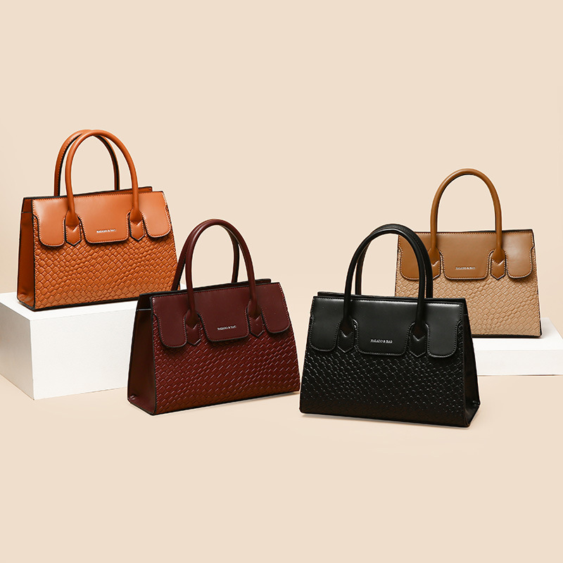 Comercio exterior transfronterizo Bolso de mujer 2024 nueva moda retro europea y americana en relieve hombro crossbody portátil de gran capacidad al por mayor