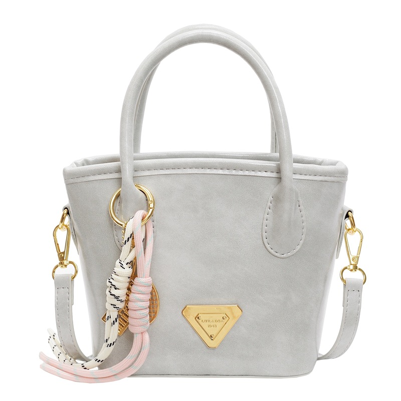 Bolso de mano de moda versátil para mujeres 2025 nuevo color de contraste de moda de un solo hombro bolso de cubo de alta sensación de mochila casual