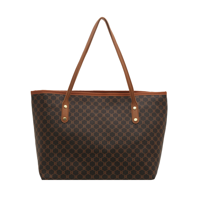 Bolsos sencillos y de moda de gran capacidad para mujer 2025 primavera nuevo bolso de moda bolso de hombro portátil de gran capacidad para viajeros