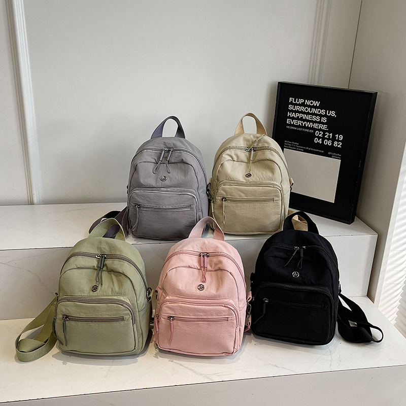 Mini mochila ligera coreana de moda casual mochila de viaje al aire libre de viaje de viaje simple mochila de estudiantes