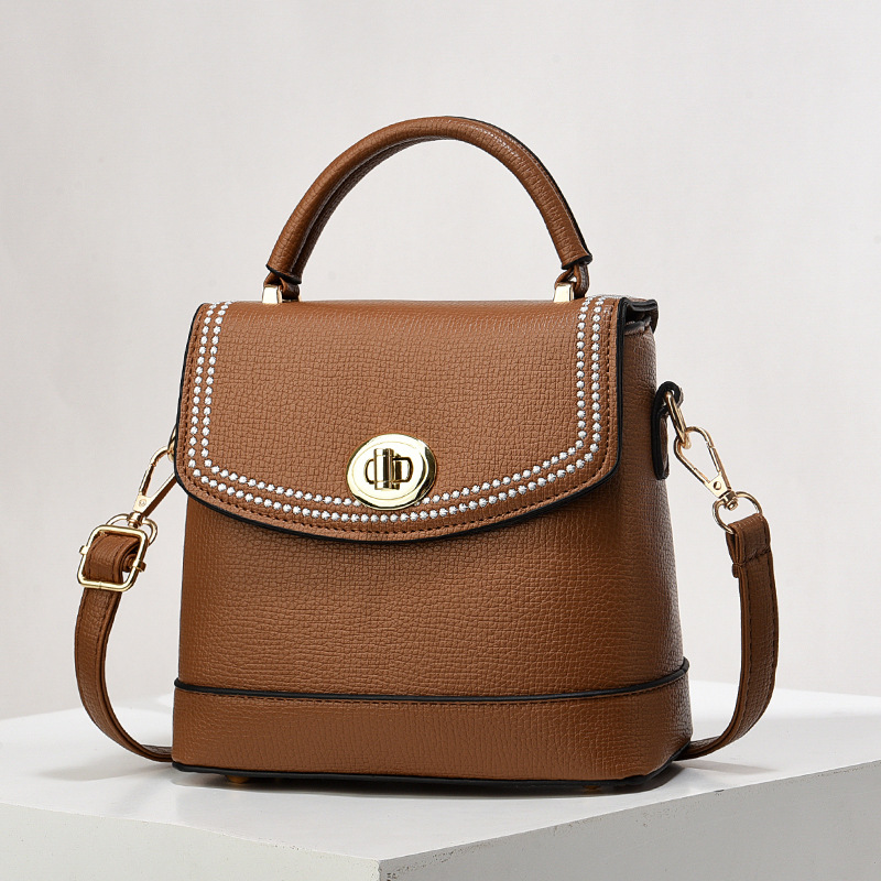 Bolso de mujer nuevo nicho de diseño texturizado bolso de hombro de moda moda bolso de mano práctica mochila bolsas