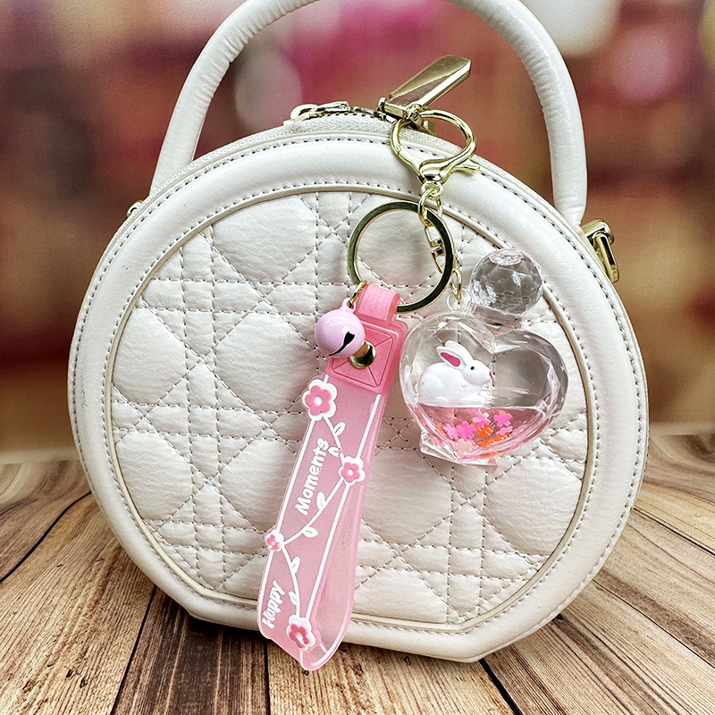Colgante de llavero de conejo de botella de arena rosa, muñeca flotante creativa, decoración de mochila para niña, regalo exquisito para pareja