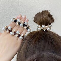百合の真珠の髪輪の女性ネットの赤は団子の頭を刺します。