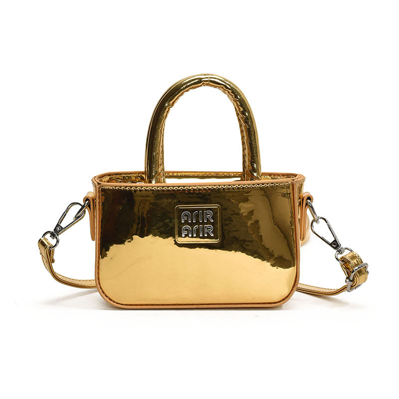 Bolsa de hombro coreana para niñas de color sólido, bolso láser de moda, mini bolso para bebés, 2025 nuevo bolso para niños
