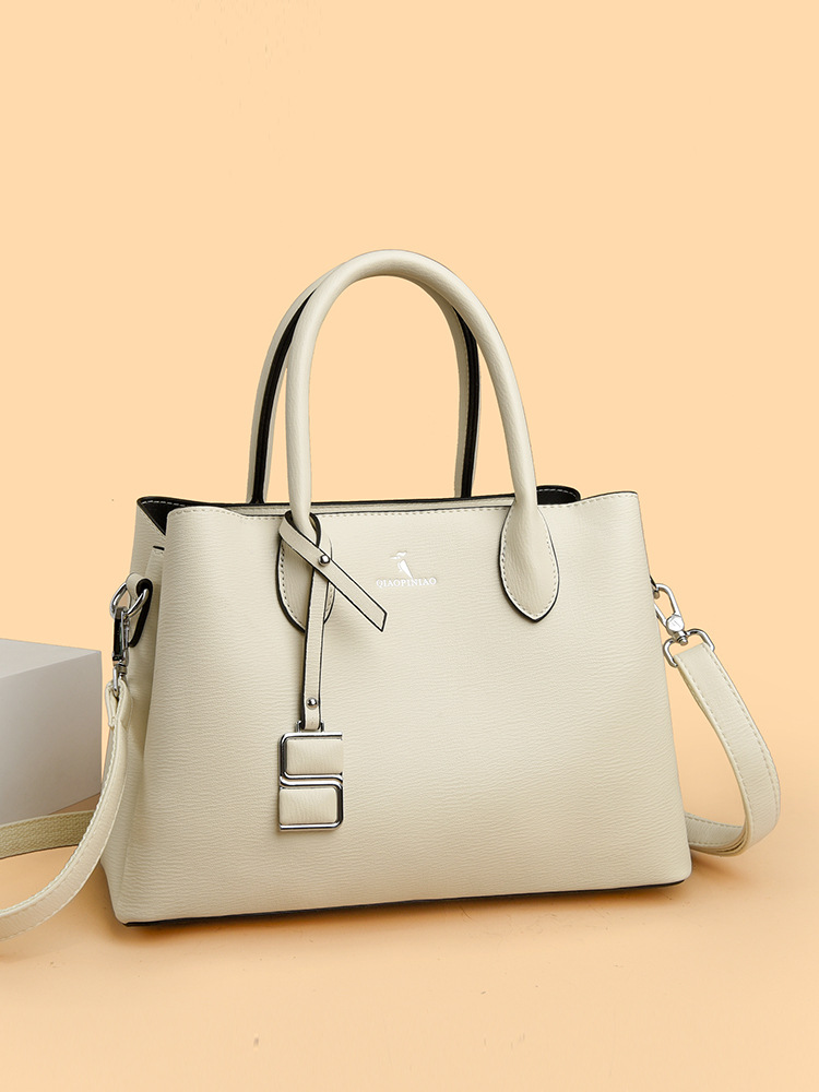 Nuevo bolso de mujer simple de moda, bolso de mano de cuero suave de gran capacidad, bolso de tela de mujer, bolso de canguro