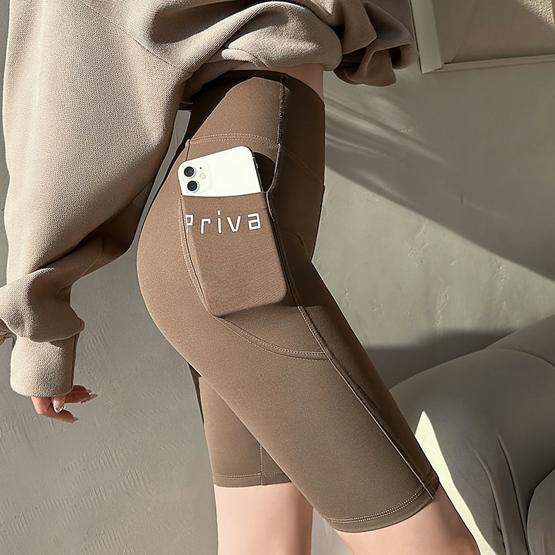 Verano delgado de cinco puntos pantalones de tiburón desgaste exterior de las mujeres bolsillo pantalones cortos vientre contracción cadera levantamiento Barbie polainas de las mujeres