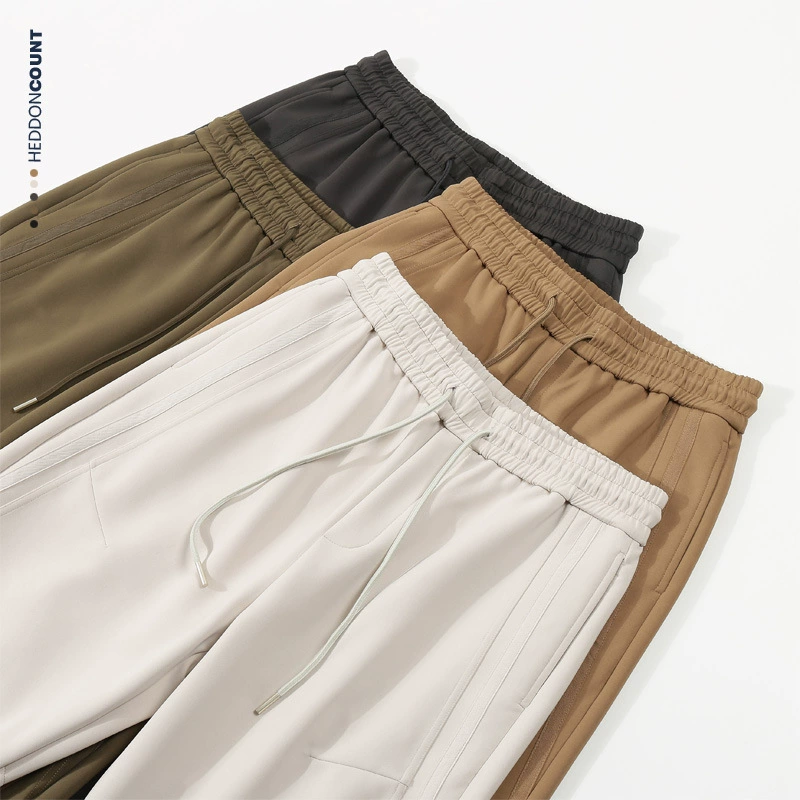 Dengjue мужской воздушный слой с разделением дизайна эластические брюки для ног свободные осенние новые повседневные брюки для мужчин и женщин