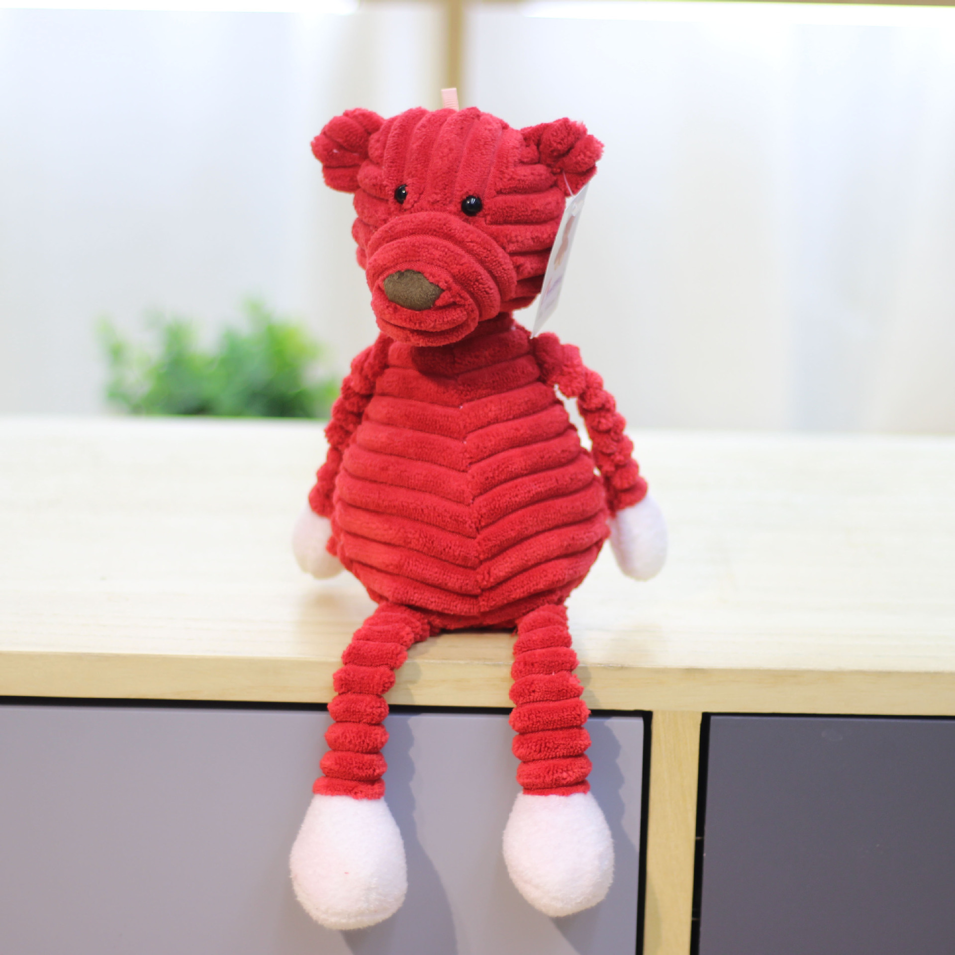 Fuente de la fábrica a rayas animal felpa muñeca de juguete creativo animal muñeca grab máquina muñeca al por mayor accesorios de ropa