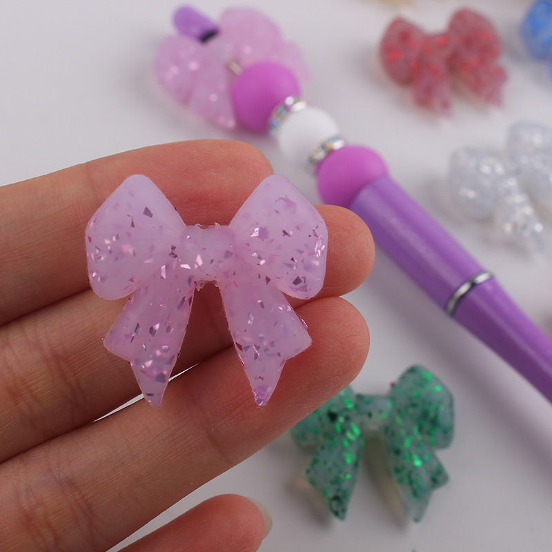 Nuevo arco brillante perlas de silicona para bebés pequeños collar de dentín accesorios de cuentas de caricatura perlas de silicona al por mayor