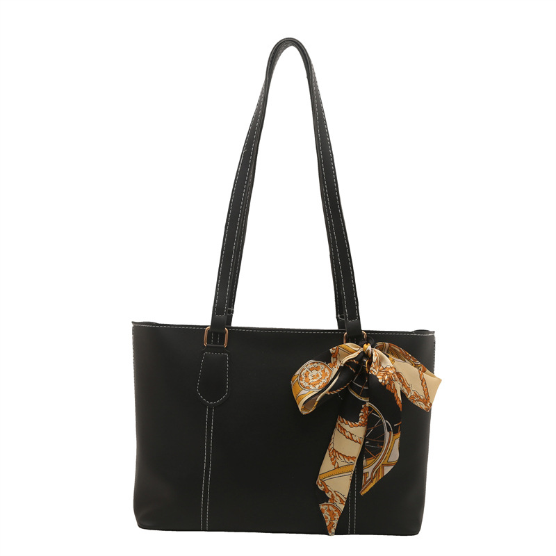 Retro alta sensación de bolso de viaje 2025 primavera y verano nuevo estilo versátil ins bolso de hombro de trabajo de color sólido bolso especial