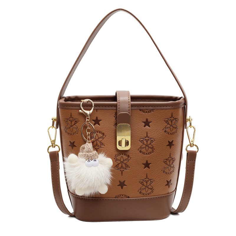 Super caliente bolso de cubo de mano mujer 2025 nueva moda relieve bolso de hombro de alta calidad humedad versátil bolso de mochila