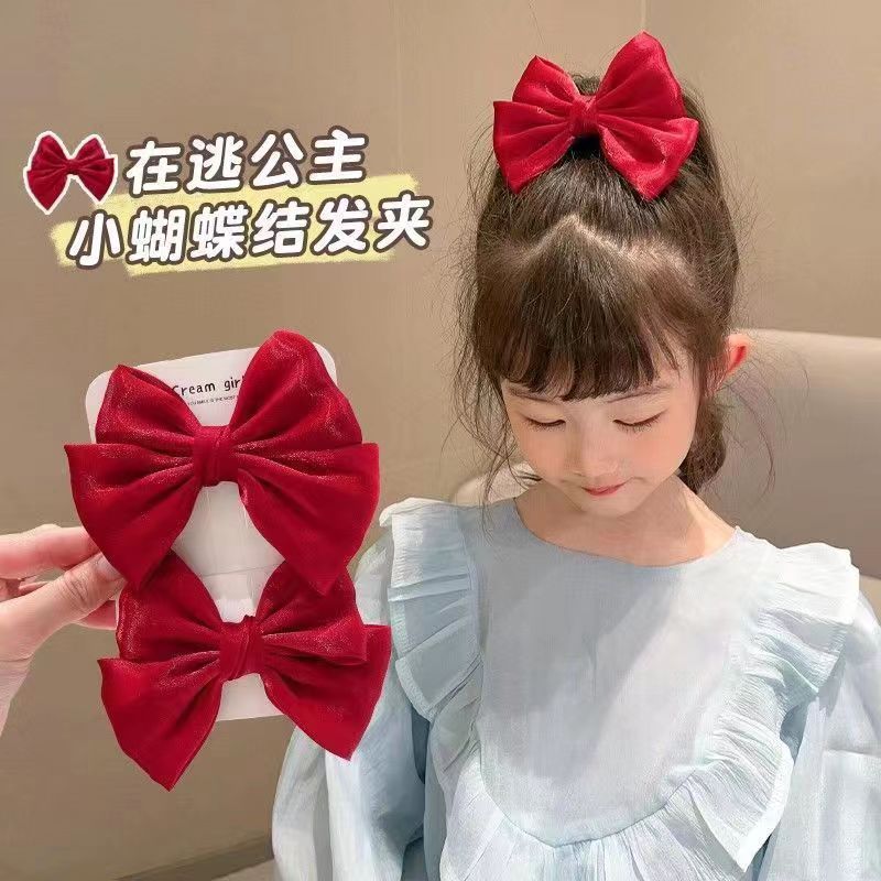 Cute children's fuchsia red universal hairgrip with bow