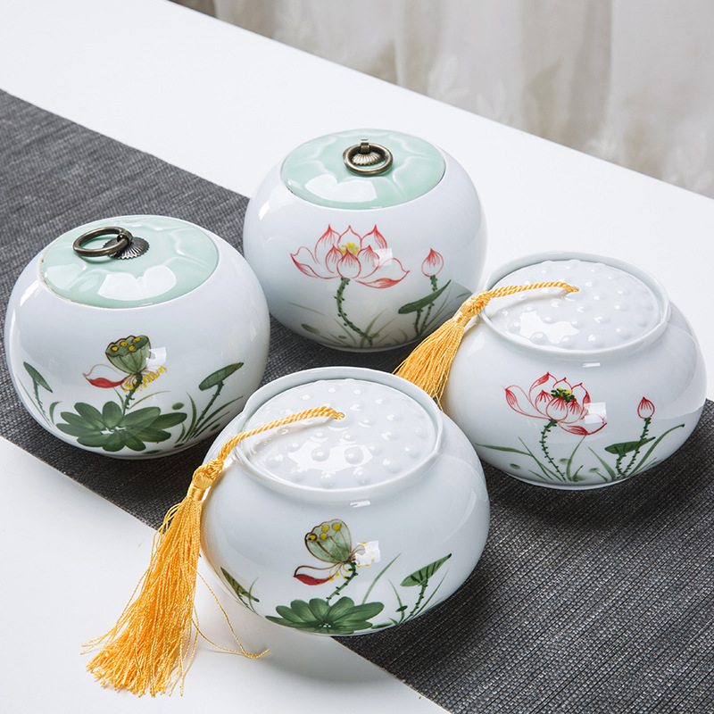 Bai porcelain large belly jar household half-pound capacity tea storage jar hand-painted lotus flower ceramic tea can sealed jar gift box packaging wholesale