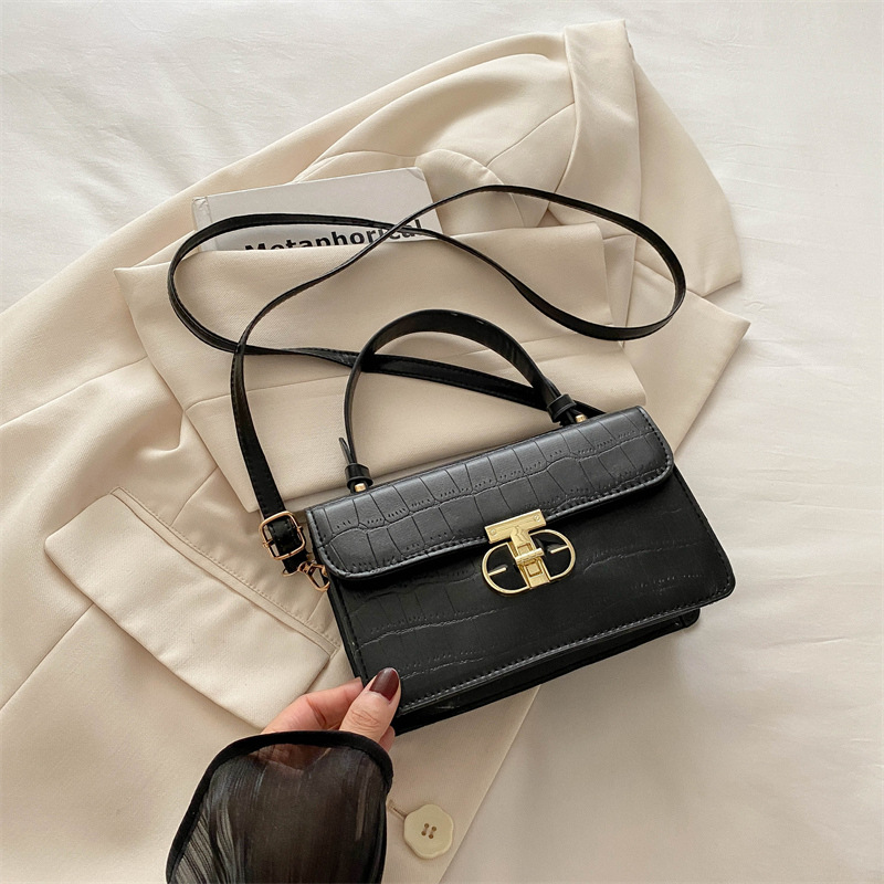 Este año, la popularidad de la bolsa de nicho de mujeres, la caja de bolsas 2024, el nuevo bolso pequeño, simple bolso de hombro con patrón de piedra, bolso cuadrado