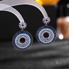 New European and American-style sweet, exaggerated earrings for women: vintage blue design with intricate craftsmanship, featuring a gradient pink zircon and a vibrant rainbow hoop.