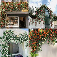 高級シミュレーションバラの藤条門頭装飾花の壁ネットの赤い写真を撮って、バラの壁のパイプを打ってつるを飾ります。