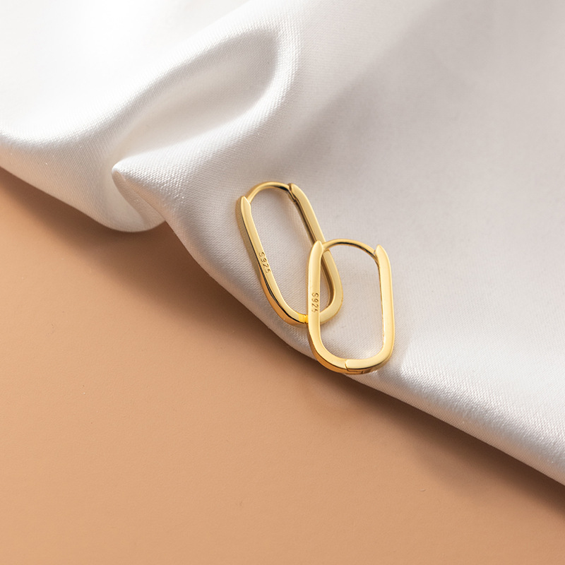 Eloch s925 plata hueco elíptico brillante auriculares coreano simple pequeño fresco lote de auriculares de verano M00457